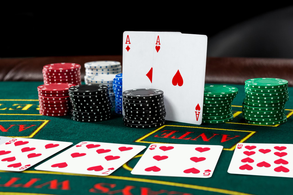 Poker chips and cards on a green table